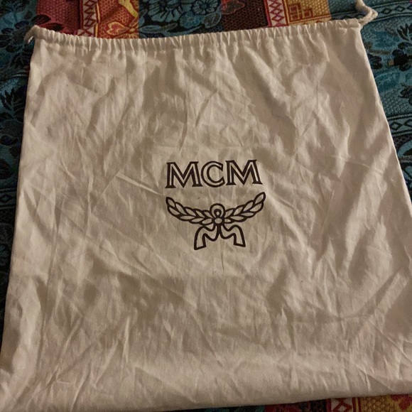It has diamonds all on the side of the bag still in good shape MCM bag black - Picture 2 of 2